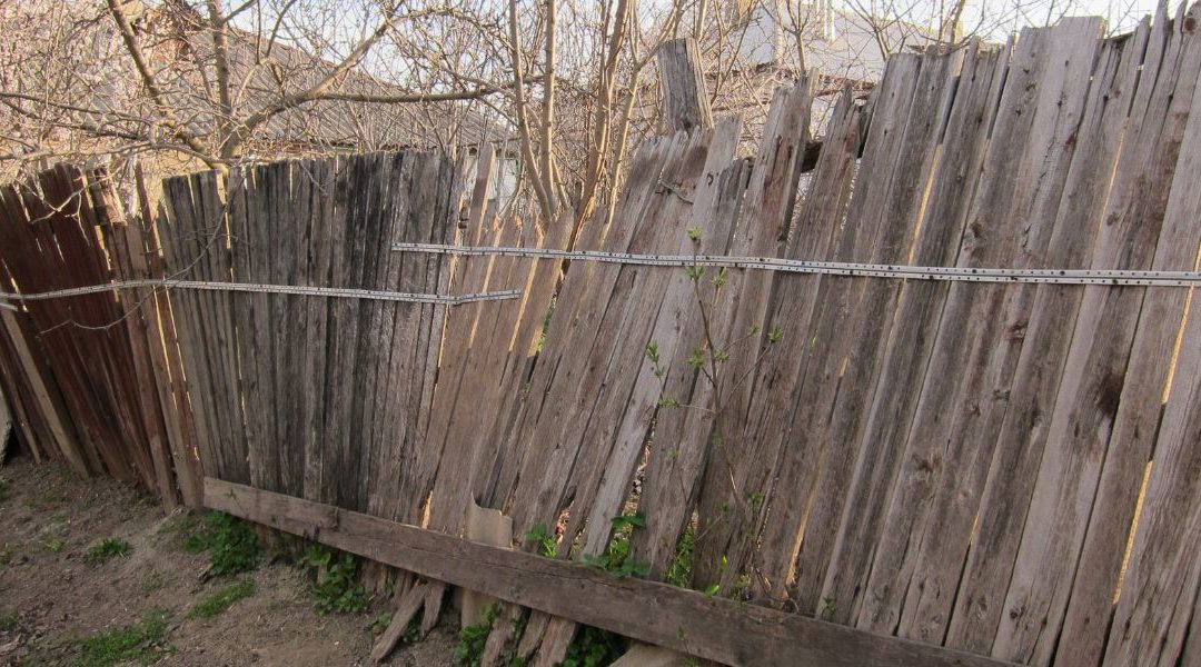 Close up of a weathered old broken fence