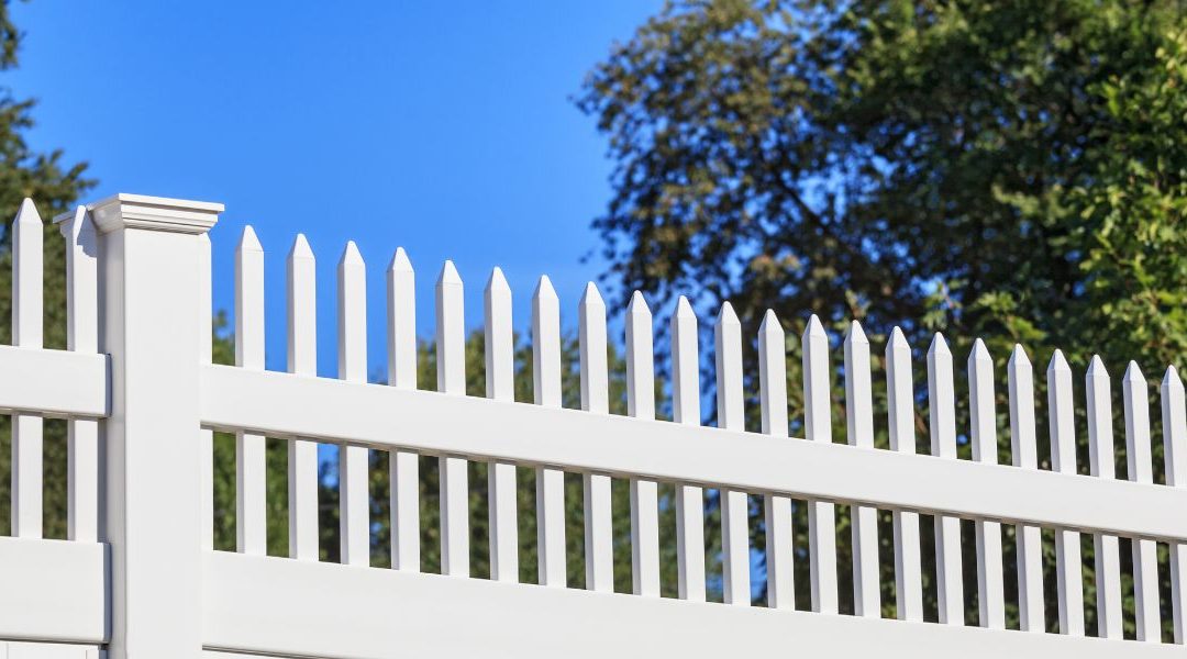 White fence with spikes
